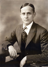 A black and white photo of a young man.