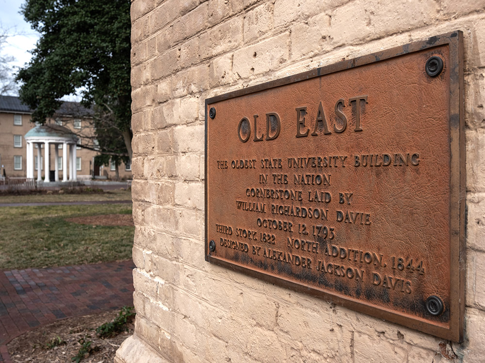 A photo of a sign that says "Old East", marking the oldest building on UNC Chapel Hill's campus.