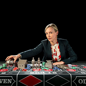 A woman at a poker table.