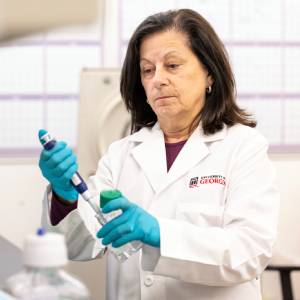 Karen Norris, a scientist, in a lab conducting an experiment.